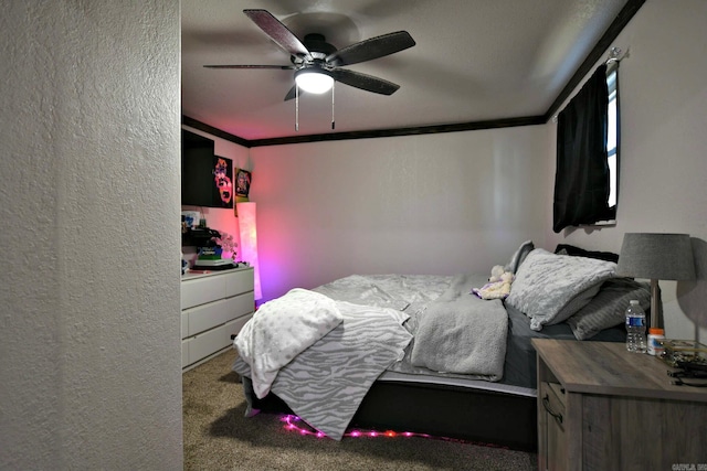 bedroom featuring a textured wall, ornamental molding, and carpet flooring