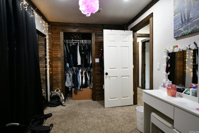 walk in closet featuring carpet