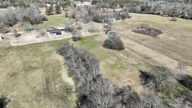 birds eye view of property with a rural view