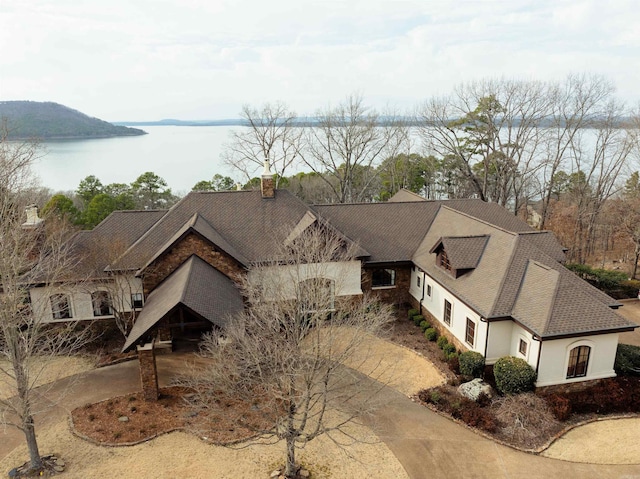 birds eye view of property with a water view