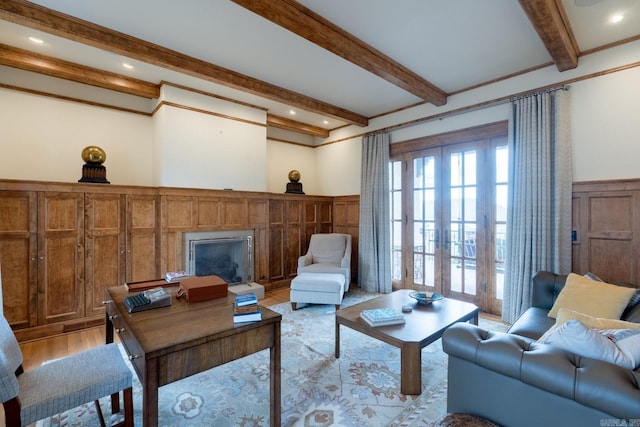 living room with french doors, recessed lighting, beam ceiling, and light wood-style floors