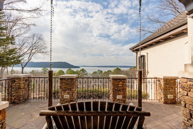 view of patio / terrace with a water view