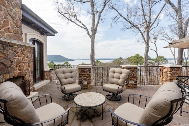 view of patio featuring a water view