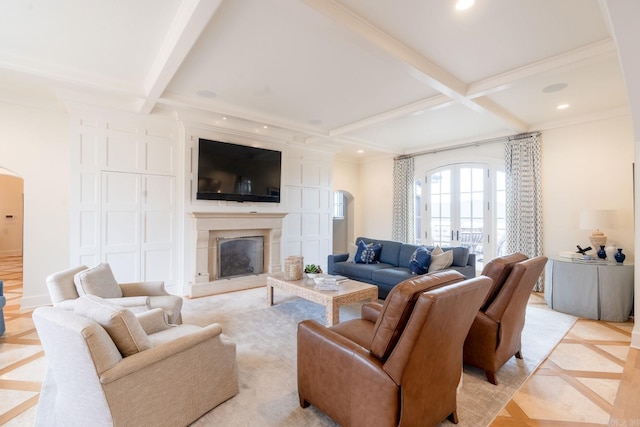 living room with coffered ceiling, a fireplace with raised hearth, beamed ceiling, and recessed lighting