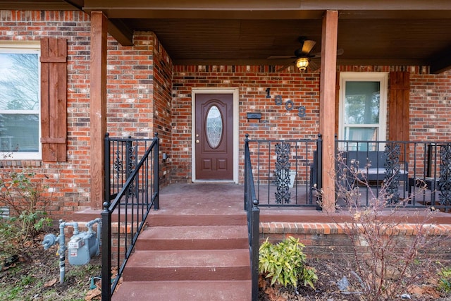 doorway to property with brick siding