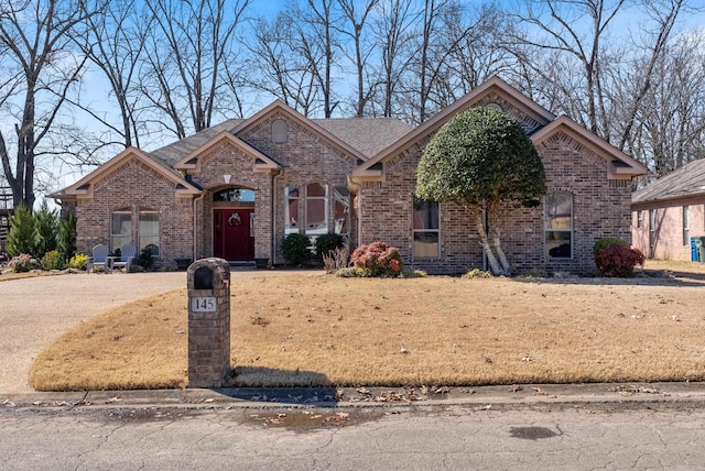 view of front of house with brick siding