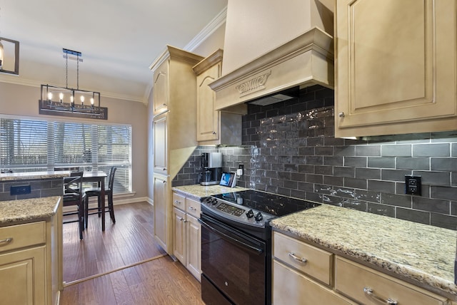 kitchen with electric range, wood finished floors, custom exhaust hood, crown molding, and light brown cabinets