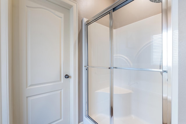 full bathroom with a shower stall