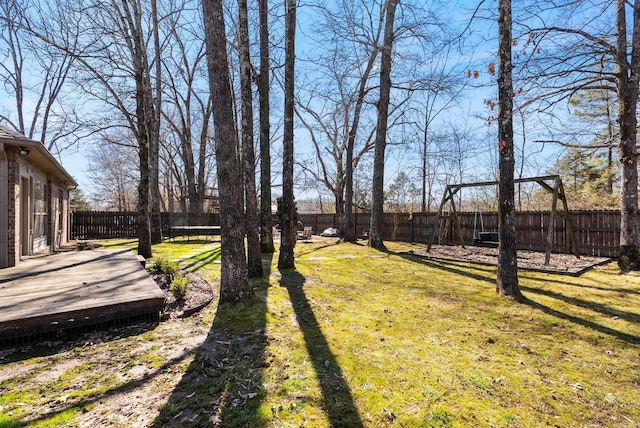 view of yard featuring a fenced backyard and a wooden deck