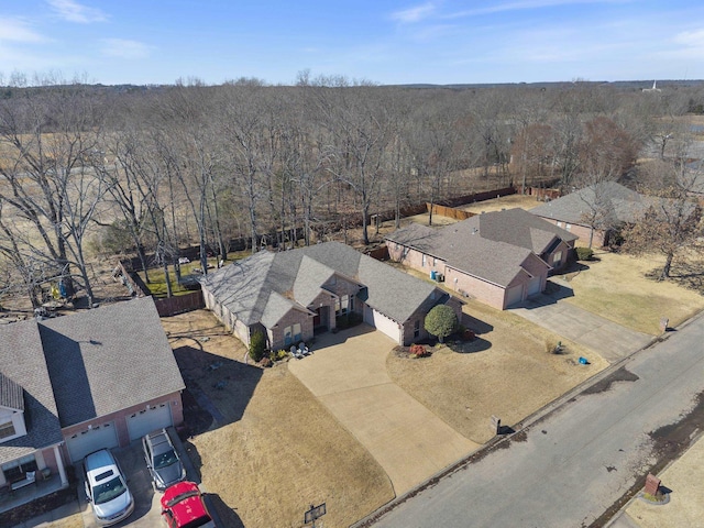 drone / aerial view featuring a forest view