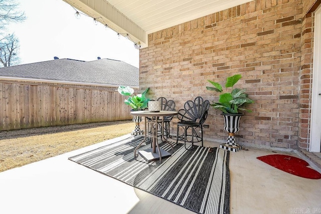 view of patio featuring fence