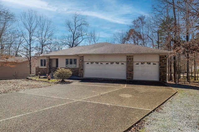 ranch-style home with a garage, stone siding, driveway, and a shingled roof