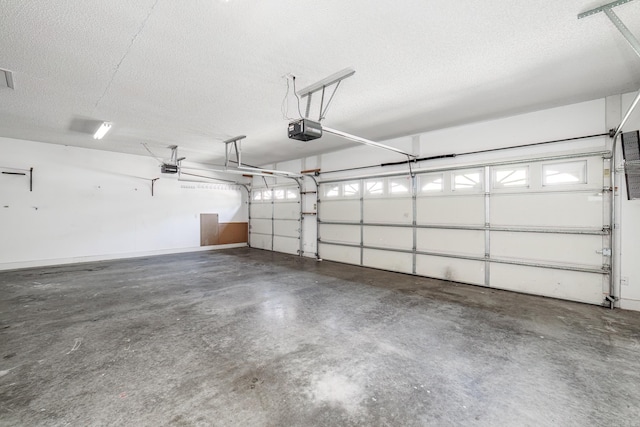 garage featuring baseboards and a garage door opener