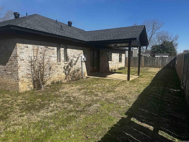 view of yard featuring a patio and a fenced backyard