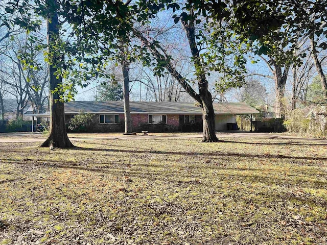 view of front of property with an attached carport