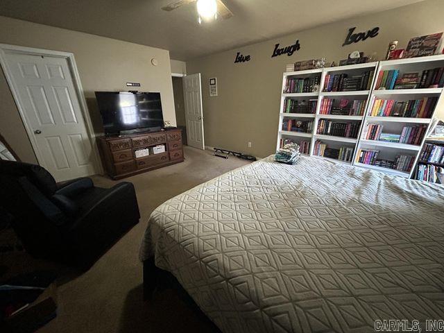 bedroom featuring carpet and a ceiling fan