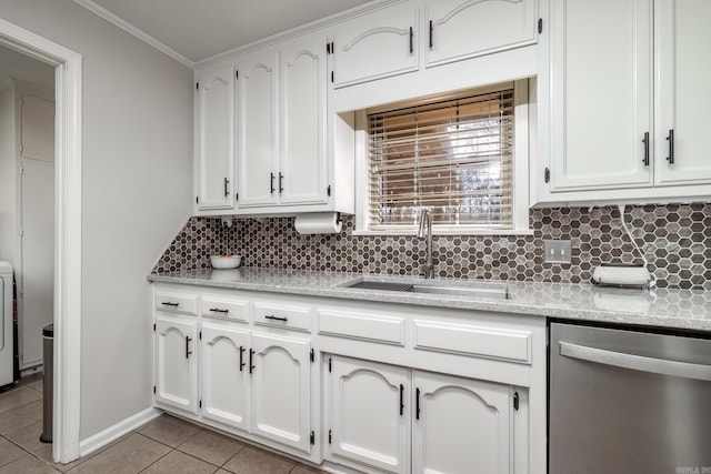 kitchen with light tile patterned floors, light countertops, backsplash, a sink, and dishwasher