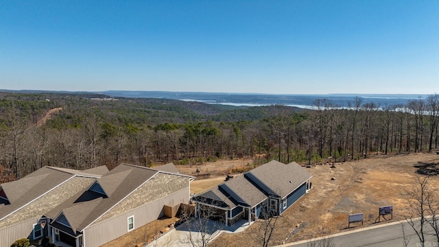 drone / aerial view with a view of trees