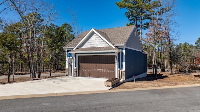 garage with concrete driveway