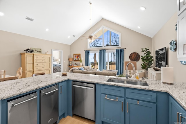 kitchen with dishwasher, visible vents, blue cabinetry, and a sink