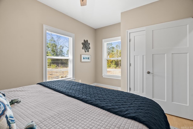 bedroom featuring light wood-style floors and ceiling fan