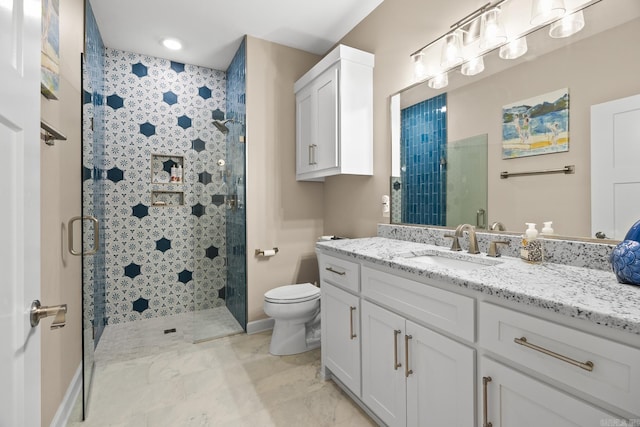 full bath featuring marble finish floor, a stall shower, vanity, and toilet