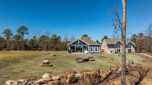 exterior space with fence and a yard