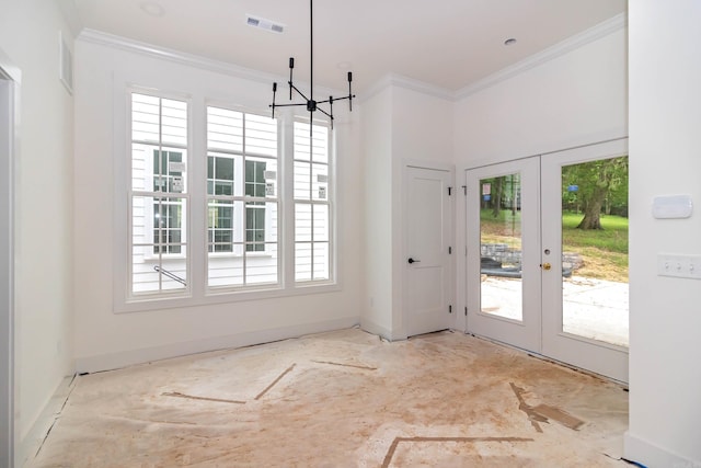 unfurnished dining area with french doors, visible vents, crown molding, and baseboards