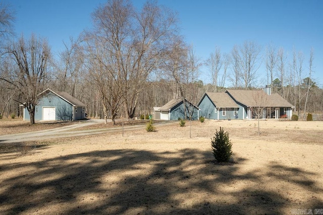 view of yard with driveway and a garage