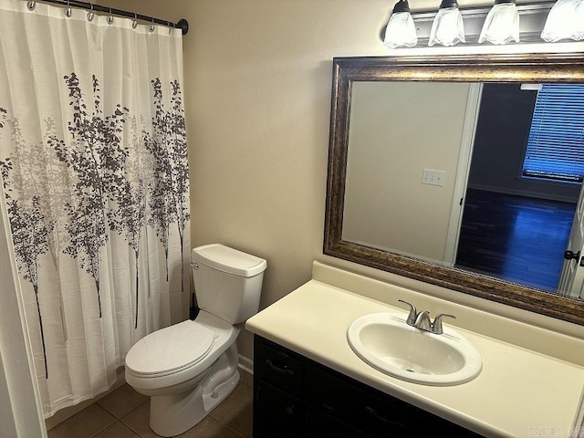 full bathroom featuring toilet, a shower with curtain, vanity, and tile patterned floors