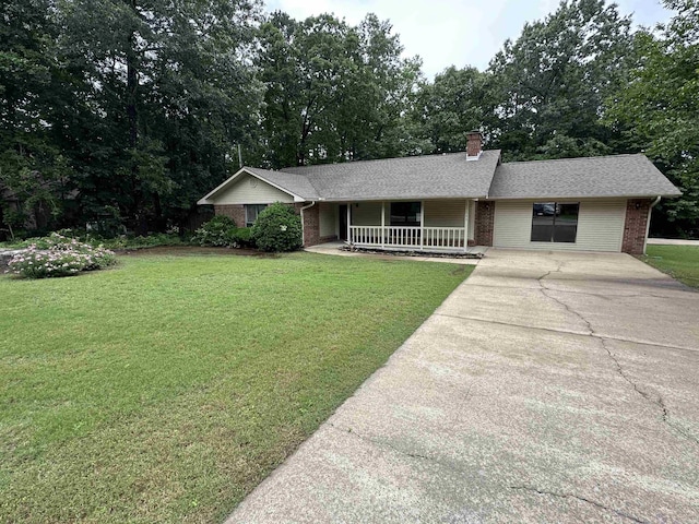 509 E Achoma Dr, Heber Springs, AR 72543 - ranch-style home with concrete driveway, a porch, brick siding, and a front yard