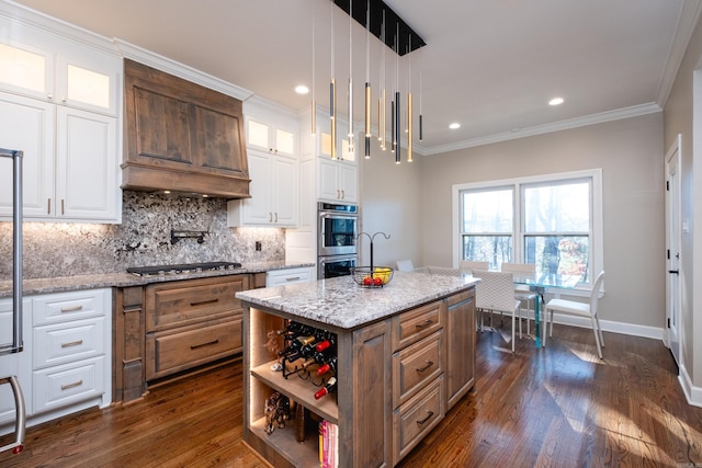 kitchen featuring stainless steel appliances, white cabinetry, decorative backsplash, and dark wood-style floors