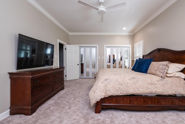 bedroom with multiple closets, light colored carpet, ornamental molding, ceiling fan, and baseboards