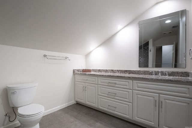 bathroom featuring lofted ceiling, visible vents, toilet, vanity, and baseboards