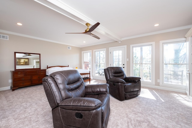 carpeted living area featuring ornamental molding, plenty of natural light, visible vents, and baseboards