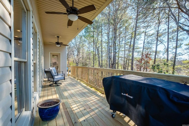 deck with ceiling fan and area for grilling