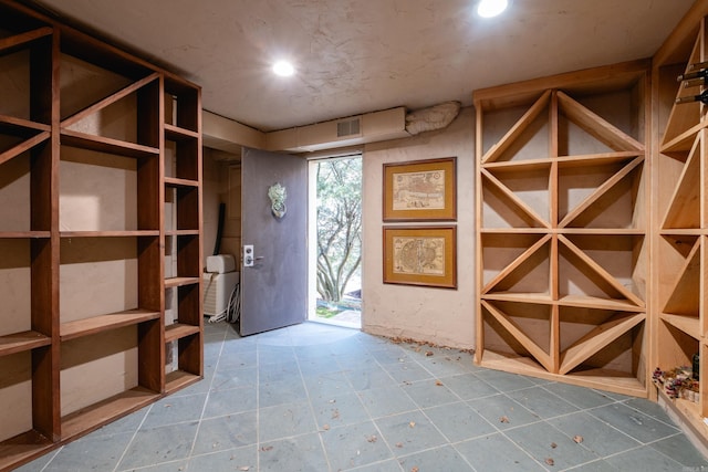 wine room featuring visible vents and recessed lighting