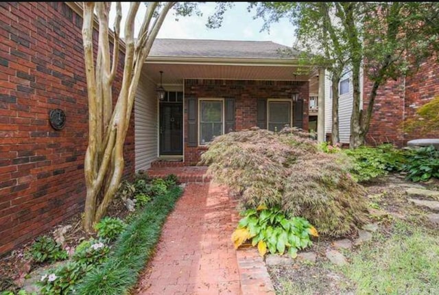 view of front of house with brick siding