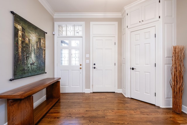 foyer featuring ornamental molding, dark wood finished floors, and baseboards