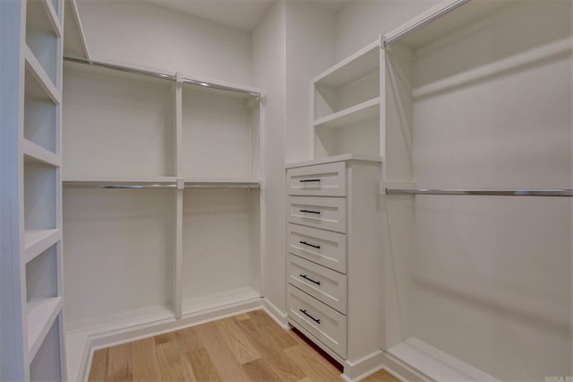 walk in closet featuring light wood-style floors