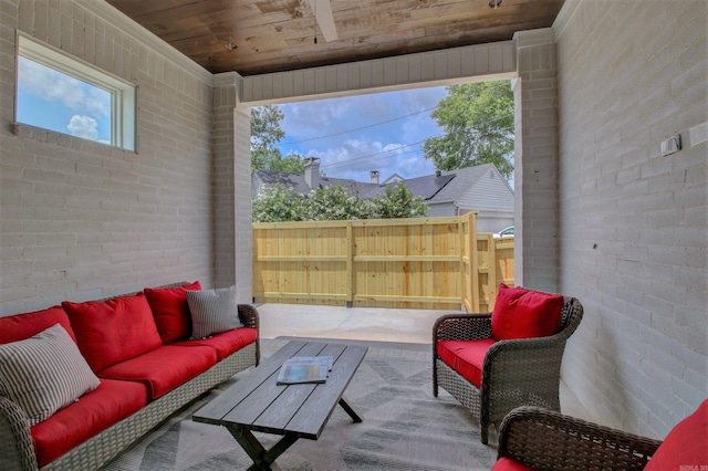 view of patio / terrace featuring outdoor lounge area and fence