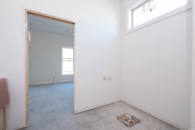 interior space with unfinished concrete flooring