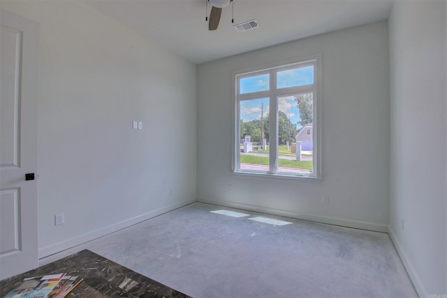 unfurnished room with visible vents, ceiling fan, and baseboards