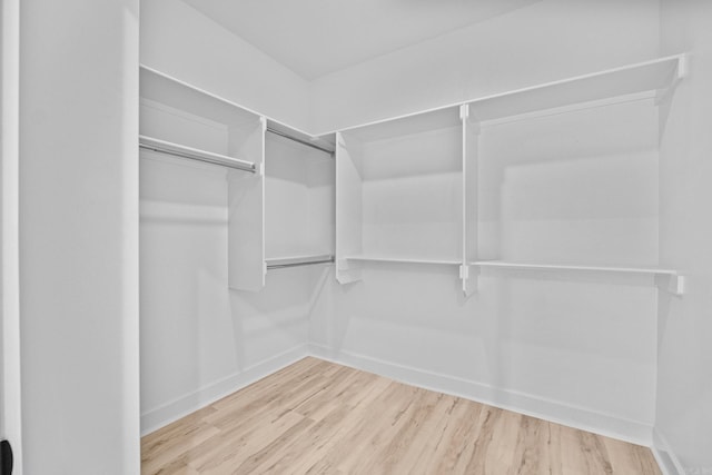 spacious closet with wood finished floors