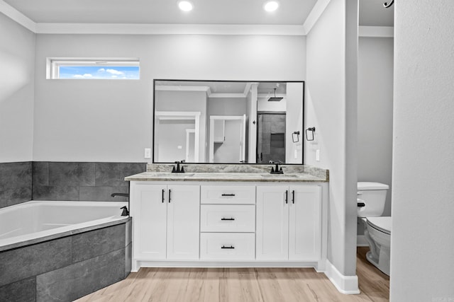 full bath featuring a bath, ornamental molding, a sink, and wood finished floors