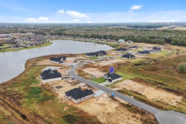 drone / aerial view featuring a residential view and a water view