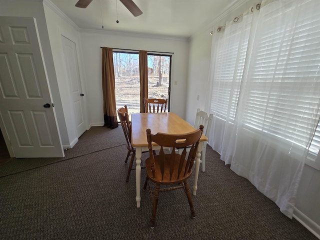 dining space featuring ceiling fan, ornamental molding, carpet flooring, and baseboards