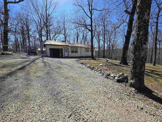 view of front of property featuring driveway and a garage