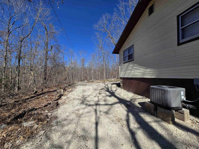 view of side of property featuring central AC unit