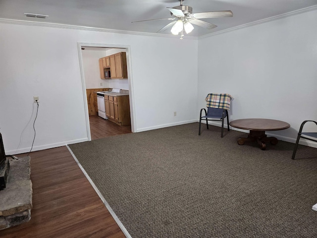 sitting room with baseboards, visible vents, ceiling fan, and ornamental molding